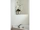 Detail of a soaking tub area with a stylish faucet and decorative floral arrangement at 2254 Show Basket Way, Mount Pleasant, SC 29466