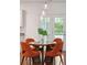 Bright dining area features modern pendant lights and a round wooden table with seating for four at 2254 Show Basket Way, Mount Pleasant, SC 29466