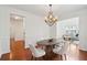 Elegant dining room featuring classic wainscoting, hardwood floors, and a stylish chandelier at 2254 Show Basket Way, Mount Pleasant, SC 29466