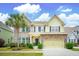Charming two-story home with a stone facade, lovely landscaping, and an attached garage at 2254 Show Basket Way, Mount Pleasant, SC 29466