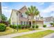 Inviting two-story home boasts stone accents, lush landscaping, and a well-manicured lawn at 2254 Show Basket Way, Mount Pleasant, SC 29466