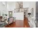 Bright foyer with soaring ceilings, gleaming hardwood floors, and staircase with white railings at 2254 Show Basket Way, Mount Pleasant, SC 29466