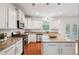 Well-lit kitchen with granite countertops, stainless steel appliances, and white cabinetry at 2254 Show Basket Way, Mount Pleasant, SC 29466