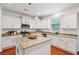 Modern kitchen featuring white cabinets, granite countertops, and stainless steel appliances at 2254 Show Basket Way, Mount Pleasant, SC 29466