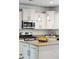 Bright kitchen features an island with granite countertops, stainless steel appliances, and pendant lighting at 2254 Show Basket Way, Mount Pleasant, SC 29466