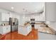 Modern kitchen boasts stainless steel appliances, granite countertops, and a spacious center island at 2254 Show Basket Way, Mount Pleasant, SC 29466