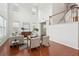Airy living room with tall ceilings, large windows, hardwood floors and neutral decor at 2254 Show Basket Way, Mount Pleasant, SC 29466