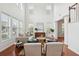 Bright living room features soaring ceilings, hardwood floors, comfortable seating, and stylish decor at 2254 Show Basket Way, Mount Pleasant, SC 29466