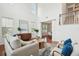 Spacious living room with lots of natural light, showcasing a modern sideboard and hardwood flooring at 2254 Show Basket Way, Mount Pleasant, SC 29466