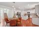 Bright open-concept living spaces showcase the kitchen, dining area, and staircase at 2254 Show Basket Way, Mount Pleasant, SC 29466