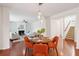 Open-concept living spaces showcasing dining area, living room with fireplace, and staircase at 2254 Show Basket Way, Mount Pleasant, SC 29466
