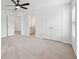 Spacious main bedroom featuring neutral carpet, ceiling fan, and ensuite bathroom at 2254 Show Basket Way, Mount Pleasant, SC 29466