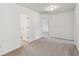 Bright room showcasing neutral paint, plush carpeting, and several doors at 2254 Show Basket Way, Mount Pleasant, SC 29466