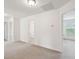 Open room showcasing neutral paint, plush carpeting, and natural light at 2254 Show Basket Way, Mount Pleasant, SC 29466