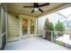 Relaxing screened porch with ceiling fan overlooking the private backyard with lush green landscaping at 2254 Show Basket Way, Mount Pleasant, SC 29466