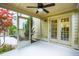 Inviting screened porch featuring a ceiling fan and picturesque views of the landscaped backyard at 2254 Show Basket Way, Mount Pleasant, SC 29466