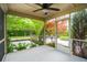 Relaxing screened porch with ceiling fan, views of the lush backyard, and a peaceful ambiance at 2254 Show Basket Way, Mount Pleasant, SC 29466