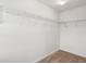 Spacious walk-in closet with white walls, wire shelving and neutral carpet at 2254 Show Basket Way, Mount Pleasant, SC 29466