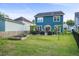 The backyard features a patio, garden beds, and lush greenery at 2324 Town Woods Rd, Charleston, SC 29414