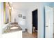Powder blue bathroom with dual sinks and a door to a toilet room at 2324 Town Woods Rd, Charleston, SC 29414