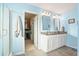 Light blue bathroom with double vanity, shower, and walk in closet at 2324 Town Woods Rd, Charleston, SC 29414