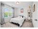 Bright bedroom featuring neutral carpet, big window and decor shelving at 2324 Town Woods Rd, Charleston, SC 29414
