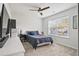 Bedroom featuring neutral carpet, a fan, big window and a dark blue bed at 2324 Town Woods Rd, Charleston, SC 29414