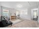 Spacious bonus room featuring a comfortable futon couch and carpeted floors at 2324 Town Woods Rd, Charleston, SC 29414