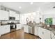 Modern kitchen with stainless steel appliances, granite countertops, white cabinets, and an open layout at 2324 Town Woods Rd, Charleston, SC 29414