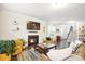 Spacious living room featuring a cozy fireplace, neutral color palette, and hardwood floors at 2324 Town Woods Rd, Charleston, SC 29414