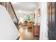 View of the Living Room from the foyer showcasing the hardwood floors and large bright windows at 2324 Town Woods Rd, Charleston, SC 29414