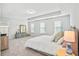 Bright main bedroom featuring a large bed, a dresser, and plenty of natural light at 2324 Town Woods Rd, Charleston, SC 29414