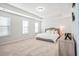 Spacious main bedroom with tray ceiling, neutral tones, and a plush bed at 2324 Town Woods Rd, Charleston, SC 29414