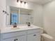 Modern bathroom featuring double sink vanity with bronze fixtures, and a shower at 239 Parkwood Vista Way, Summerville, SC 29486