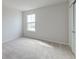 This bedroom boasts neutral walls, plush carpet, a window and closet space at 239 Parkwood Vista Way, Summerville, SC 29486