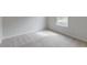 Well-lit bedroom with neutral carpet and a window with great outdoor views at 239 Parkwood Vista Way, Summerville, SC 29486