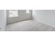 Bright and neutral bedroom space with soft carpeting, large window, and closet at 239 Parkwood Vista Way, Summerville, SC 29486