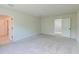 This spacious bedroom features plush carpet, neutral walls, two closets and attached bath at 239 Parkwood Vista Way, Summerville, SC 29486