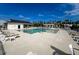 Beautiful community pool with poolside seating, umbrellas, palm trees, and pergola at 239 Parkwood Vista Way, Summerville, SC 29486