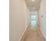 Bright hallway with wood floors leads to living spaces filled with natural light at 239 Parkwood Vista Way, Summerville, SC 29486
