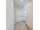 Bright hallway features wood floors, white trim, and a clear view up the staircase at 239 Parkwood Vista Way, Summerville, SC 29486