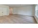 Spacious living room features wood floors and a bright window at 239 Parkwood Vista Way, Summerville, SC 29486
