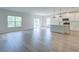 Open-concept living space features lots of light and an adjacent modern kitchen with a breakfast bar at 239 Parkwood Vista Way, Summerville, SC 29486