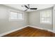 Bright bedroom featuring hardwood floors and two large windows offering tons of natural light at 2404 Menola Ave, Charleston, SC 29414