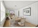 Bright dining room featuring wood floors and seating for six guests at 2404 Menola Ave, Charleston, SC 29414