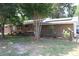 Charming brick home featuring solar panels, a well-maintained lawn, and mature trees for a serene and eco-friendly setting at 2404 Menola Ave, Charleston, SC 29414