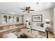 Cozy living room with hardwood floors, ceiling fan and large window at 2404 Menola Ave, Charleston, SC 29414