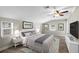 Spacious main bedroom features a ceiling fan, plenty of natural light and a walk-in closet at 2404 Menola Ave, Charleston, SC 29414