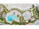 Aerial view of a community pool area featuring multiple pools, lounge seating and mature trees at 2624 Jenkins Point Rd, Seabrook Island, SC 29455