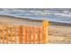 Scenic beach scene featuring a wooden fence in the foreground and ocean waves in the background at 2624 Jenkins Point Rd, Seabrook Island, SC 29455